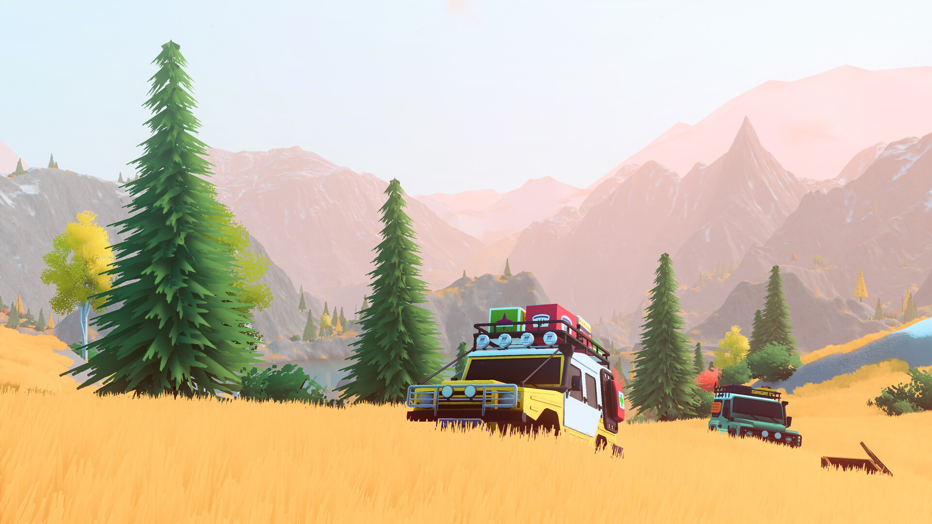 Off-road vehicles crossing golden grassland beneath pine trees and pink mountain peaks